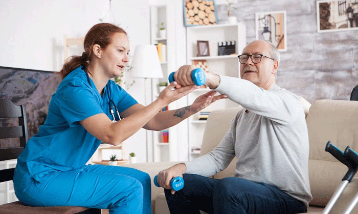 A support worker assisting a resident in a shared living home