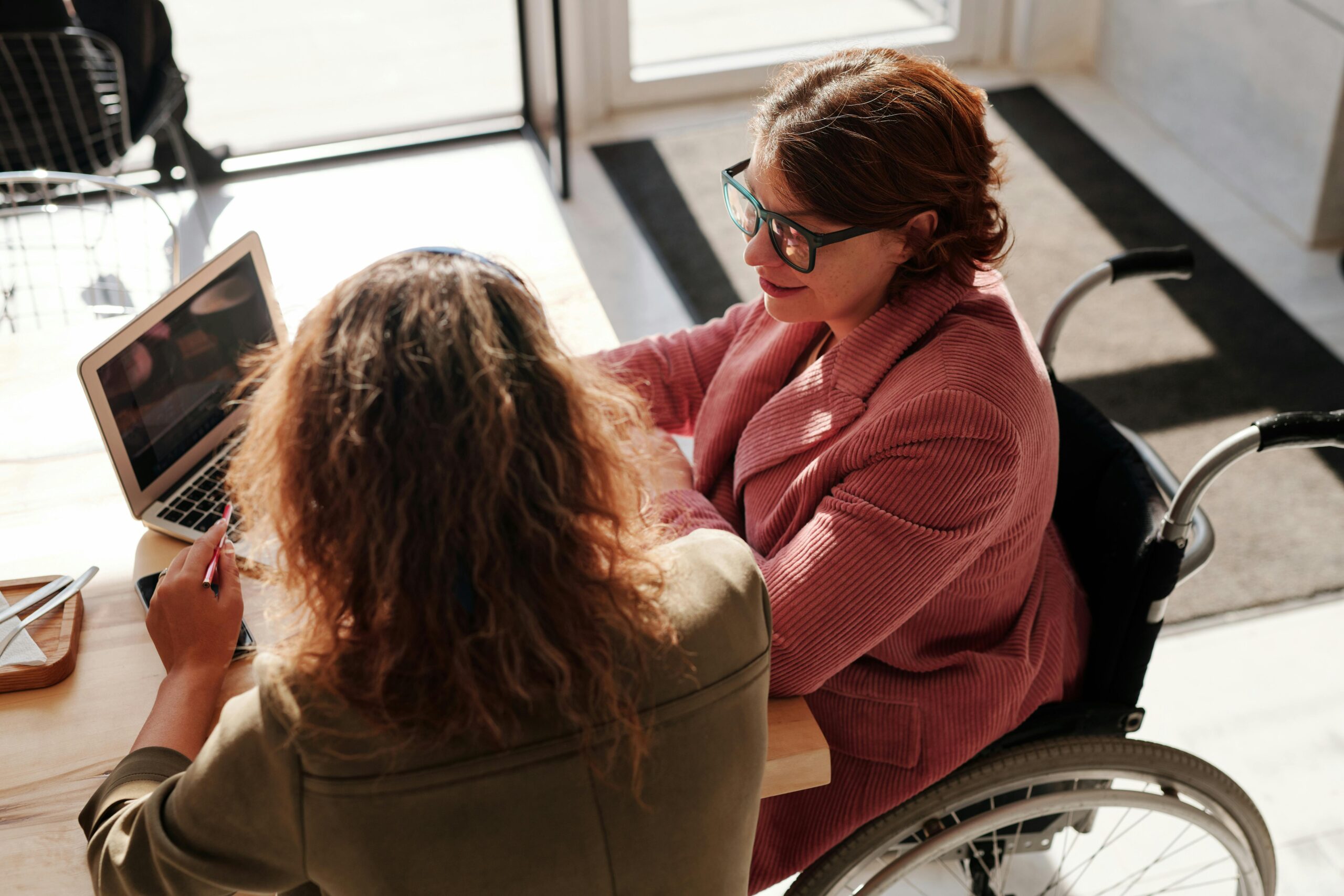 A support worker planning personalised supports with a participant