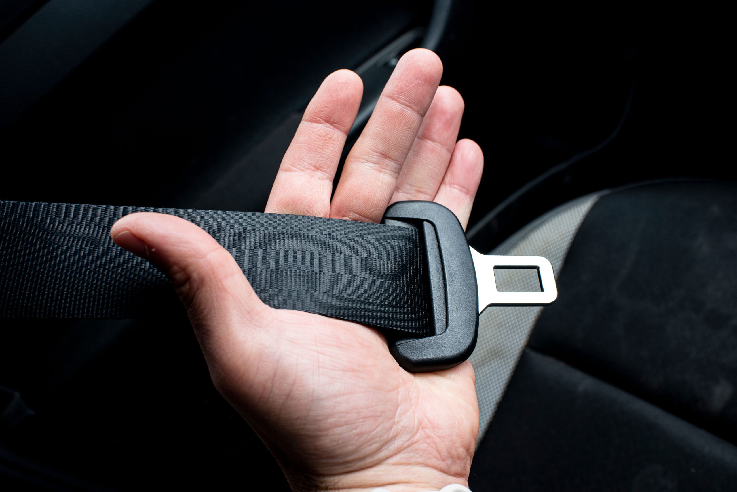 A seatbelt being fastened for a safe, comfortable journey