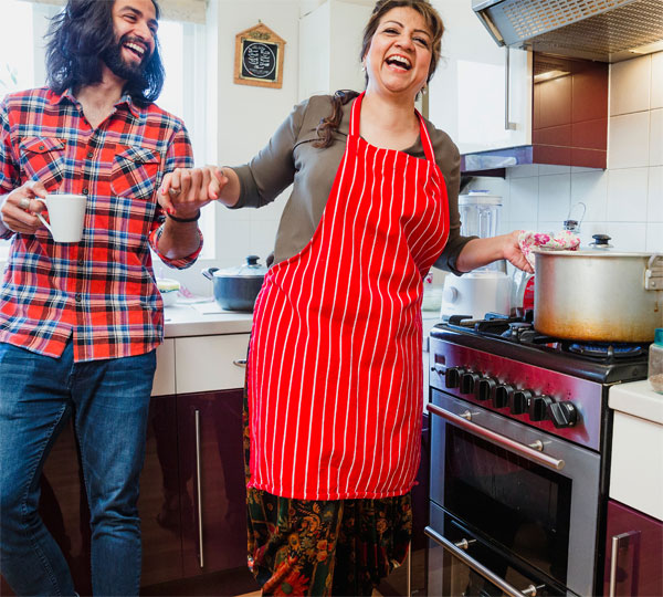 A participant learning to cook with their support worker