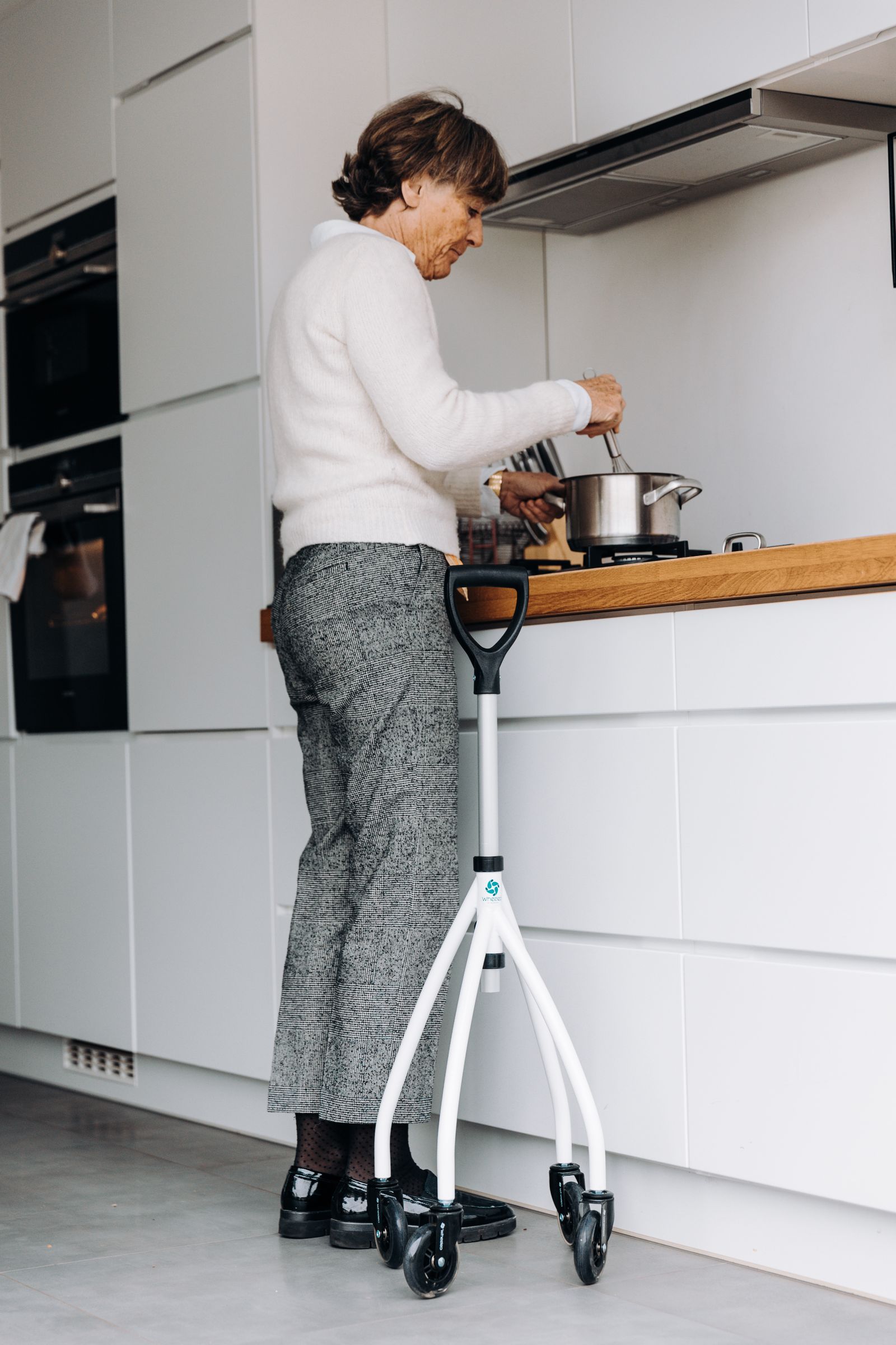 A participant preparing a meal at home with a support worker